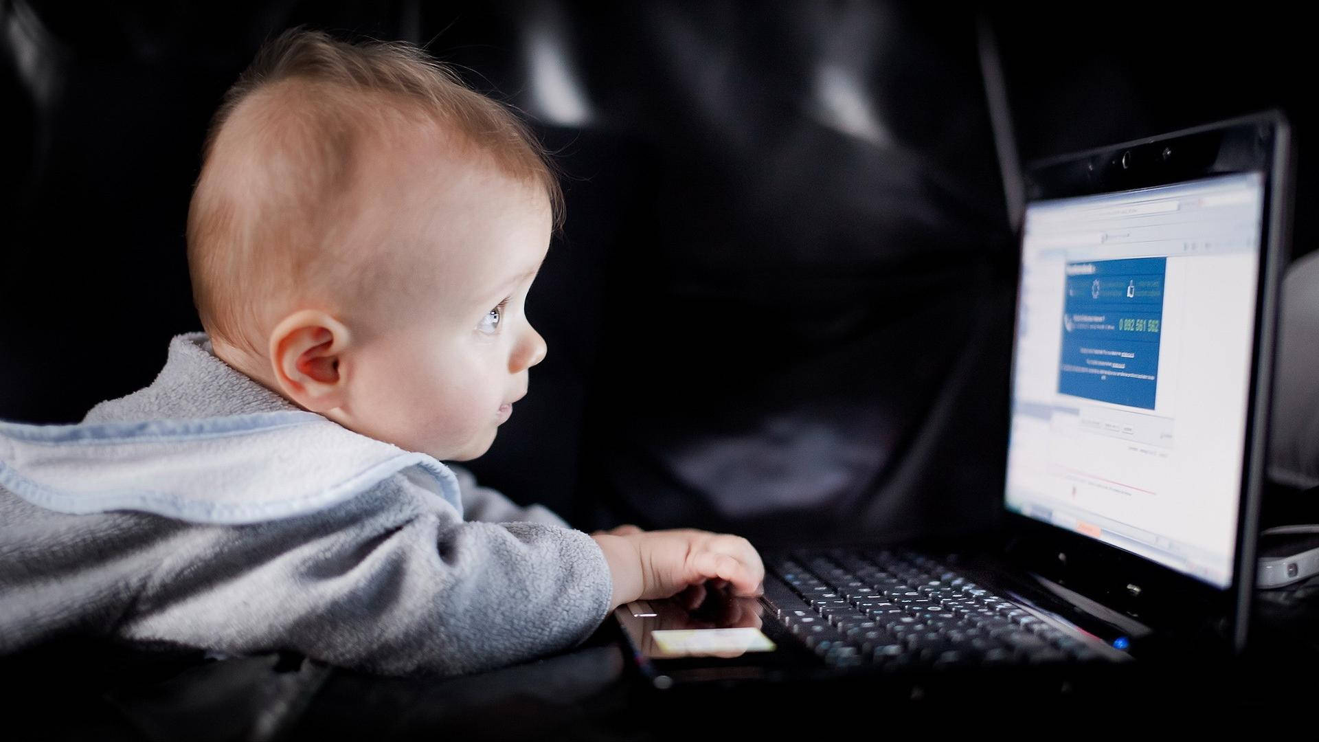 Little CEO: Adorable Baby Commanding the Home Office Wallpaper