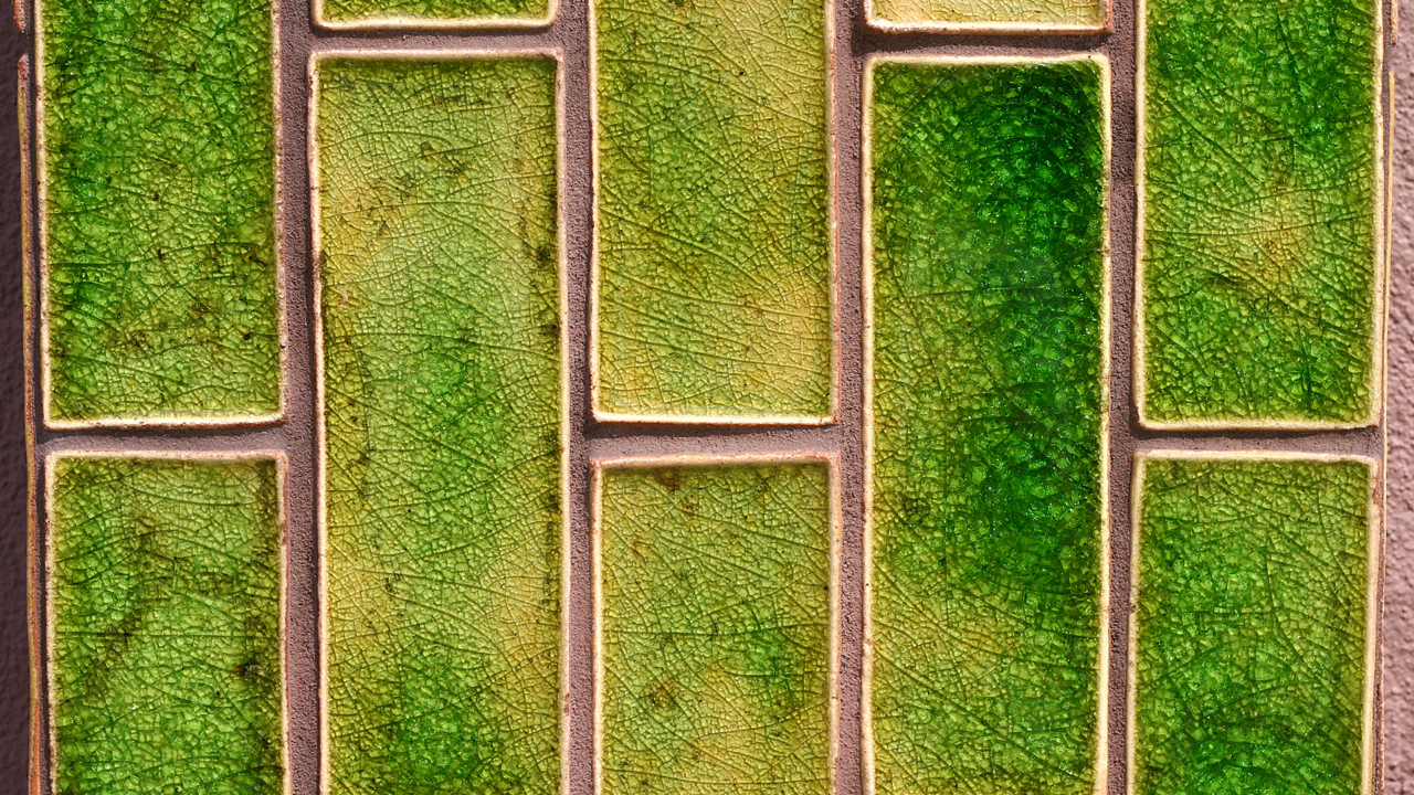 Green Tile With A Brown Background