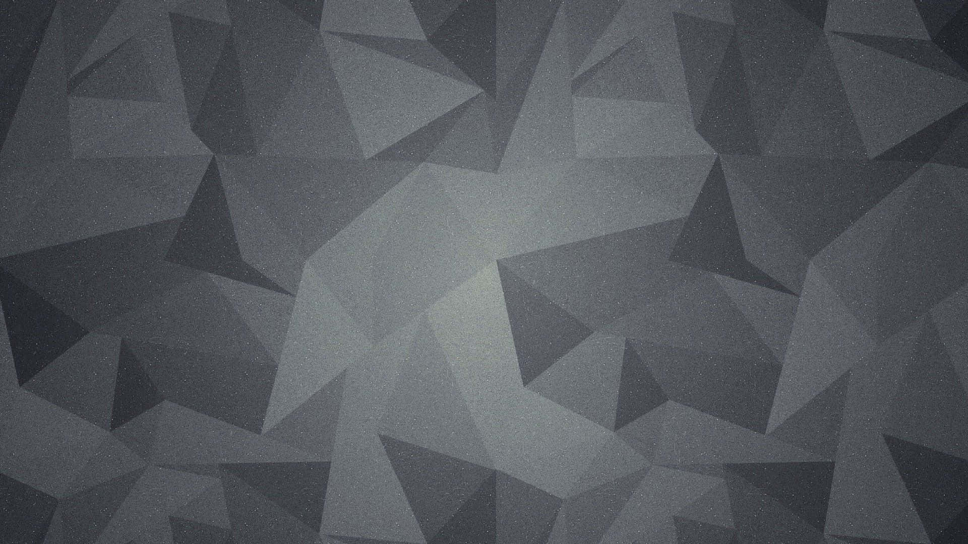 Et sort og gråt tapet med trekanter Wallpaper