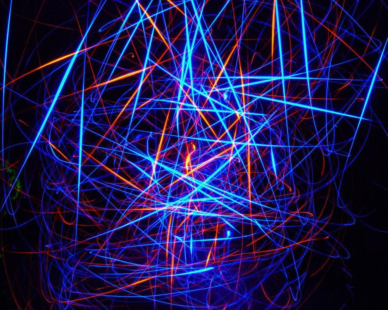 A Light Painting Of Blue And Orange Lines Wallpaper