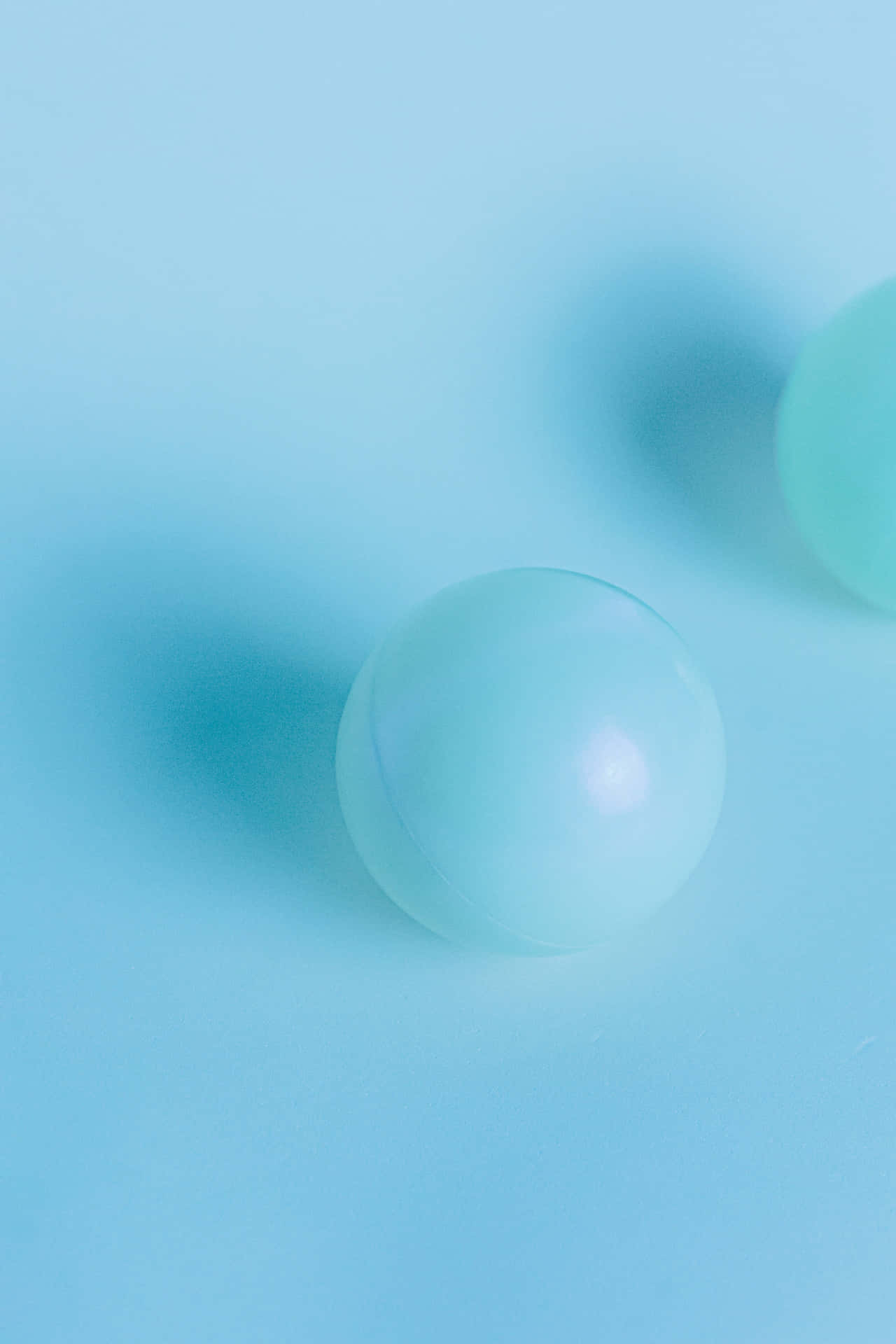 Cool Light Blue Marbles On Surface Wallpaper