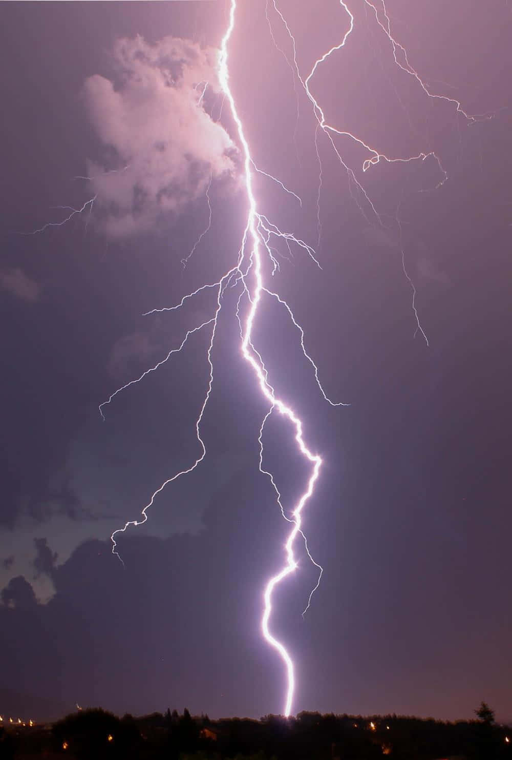 Strikingly Cool Lightning Strikes Over A Clear Night Sky Wallpaper