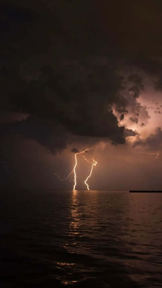 Cool Lightning Strikes Over The Water Wallpaper