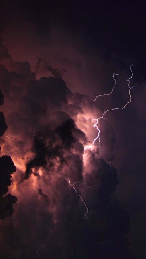 Bolts Of Lightning Illuminate The Night Sky Wallpaper
