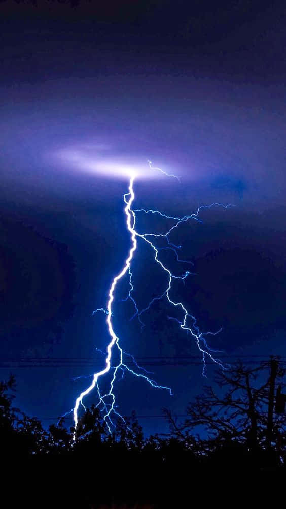 Download Striking Blue Lightning Streaks Across A Starry Night Sky ...