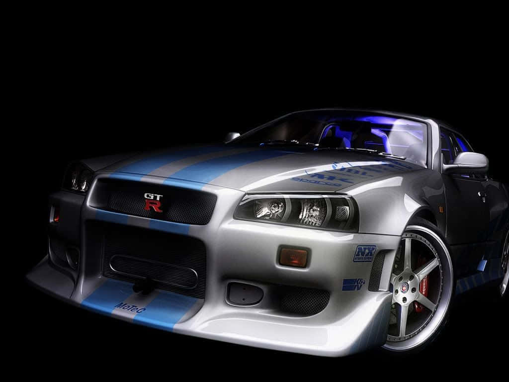 A Silver Sports Car In A Dark Background Wallpaper