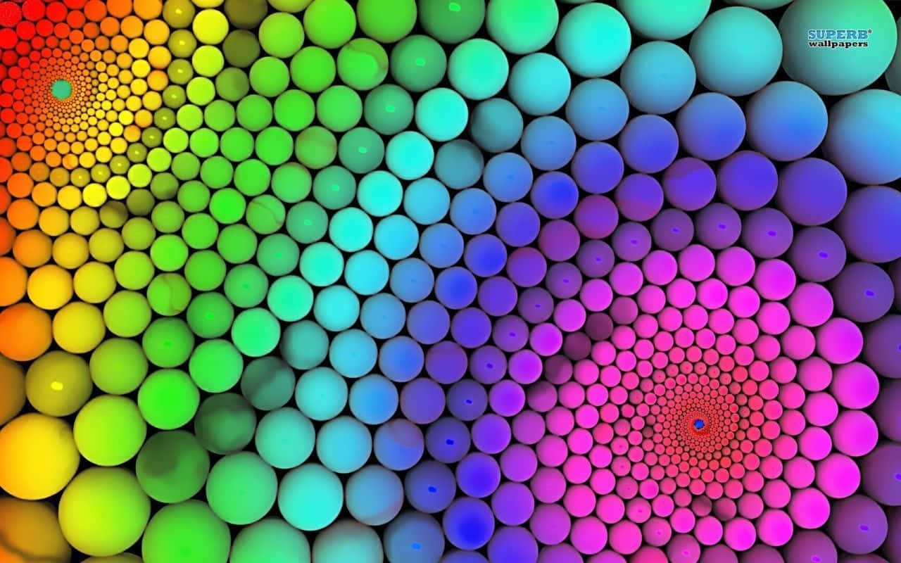 Et farverigt abstrakt billede med cirkler og cirkler af lys Wallpaper
