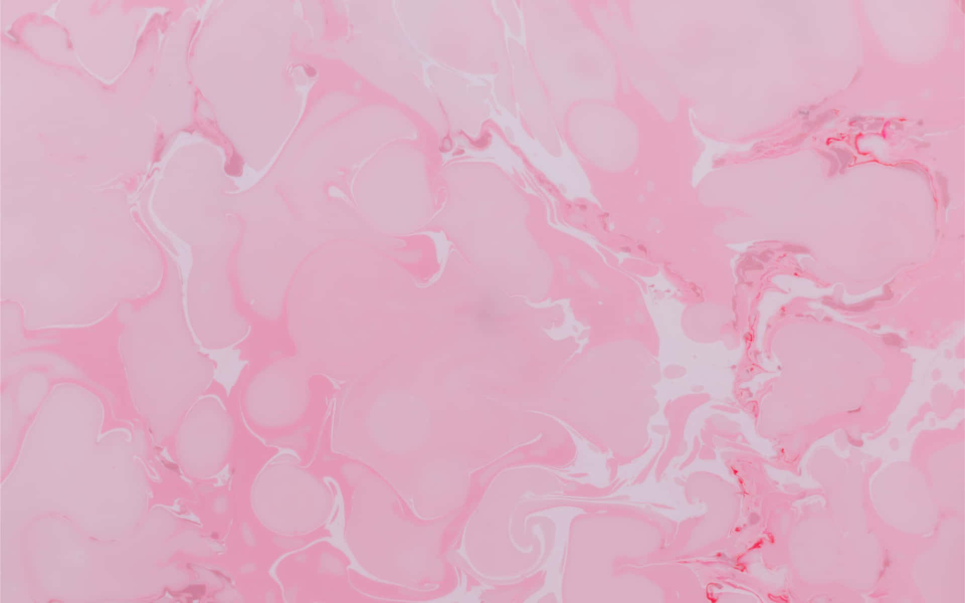 A Pink Marble Background With White Swirls