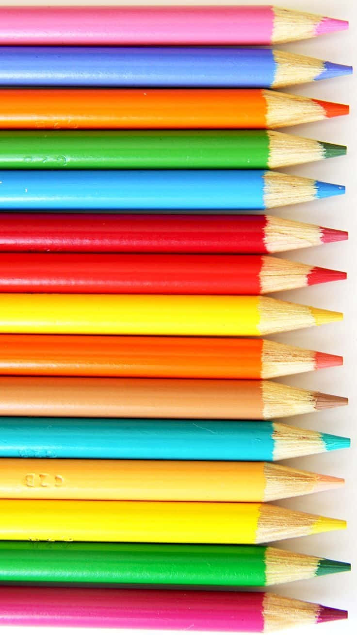 A Row Of Colored Pencils On A White Background Wallpaper