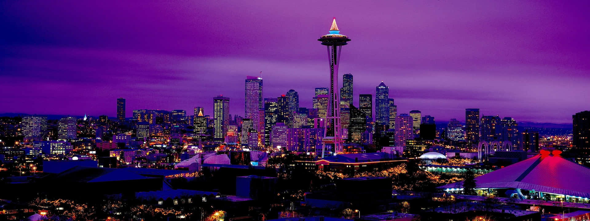 Vistadell'affascinante Skyline Di Seattle Al Tramonto Sfondo
