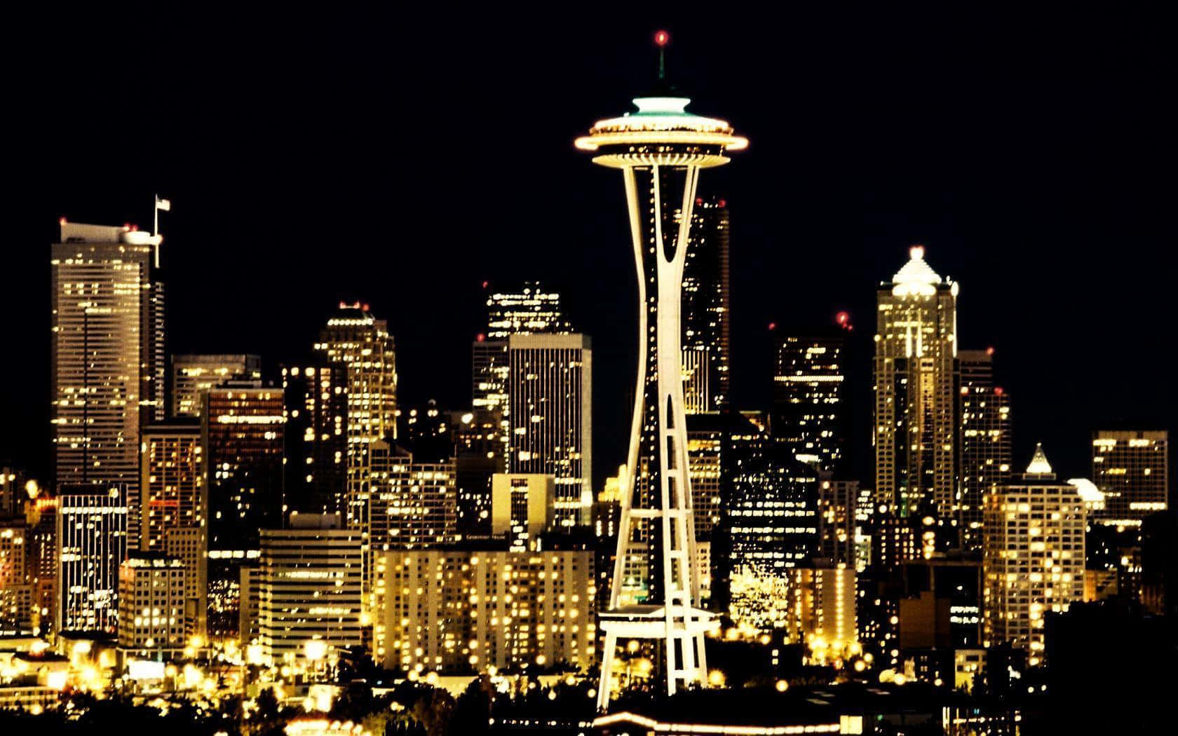 Panoramadel Skyline Di Seattle Di Notte Con La Space Needle Sfondo