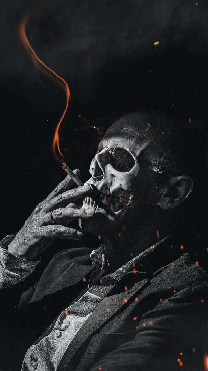 A Man Smoking A Cigarette In A Dark Room Wallpaper