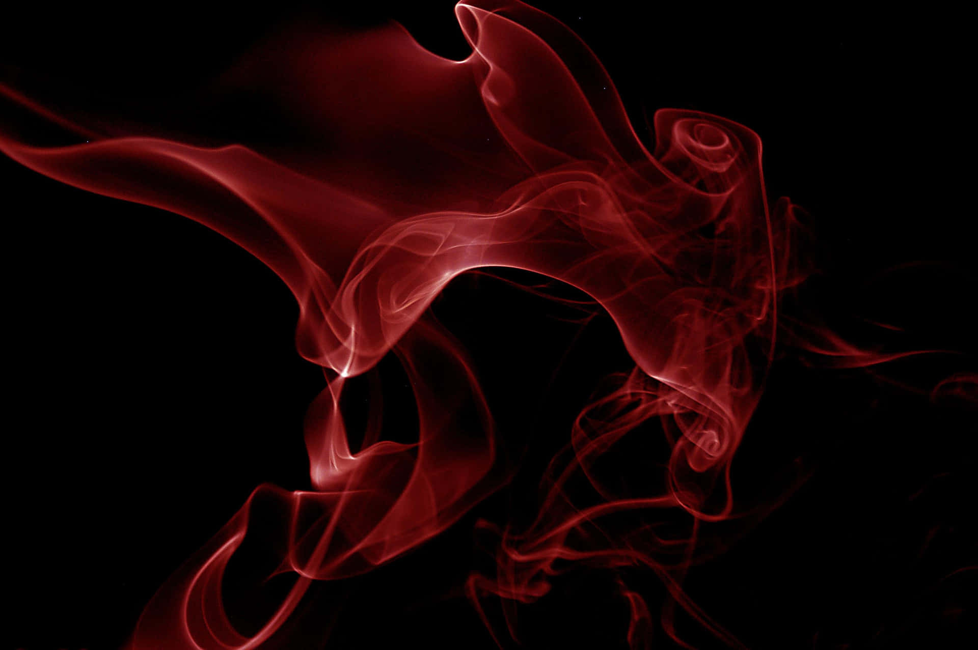 A Red Smoke On A Black Background Wallpaper