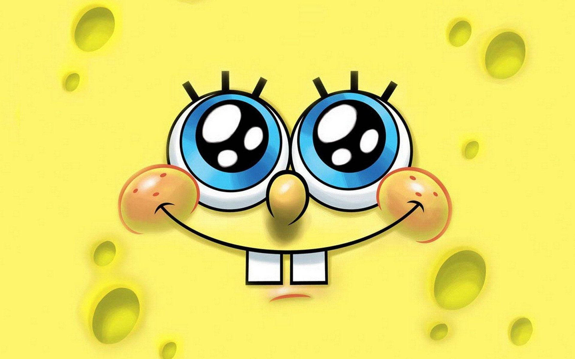 Sjov Spongebob med glimtende blå øjne Wallpaper