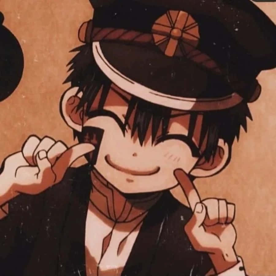 a boy in a uniform is pointing his finger
