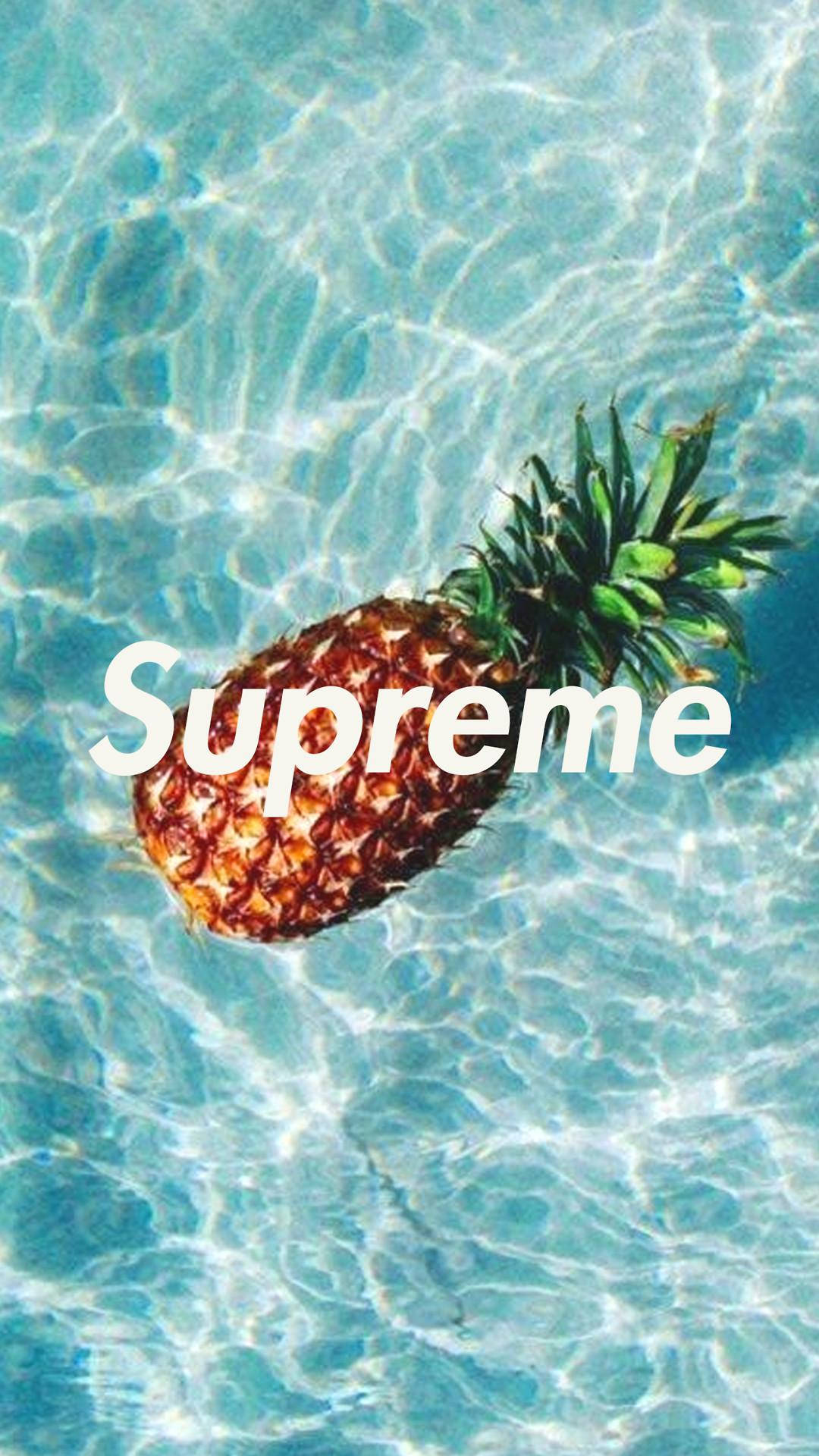 A Pineapple In The Water With The Word Supreme Wallpaper