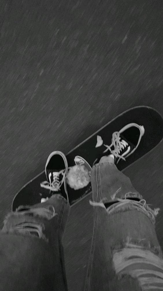 A Skateboard On A Paved Surface Wallpaper