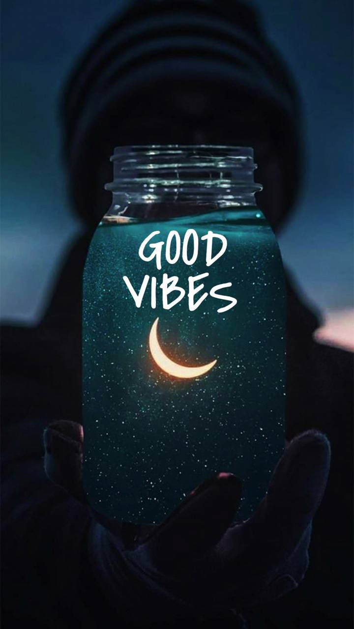 A Jar With The Words Good Vibes In It Wallpaper