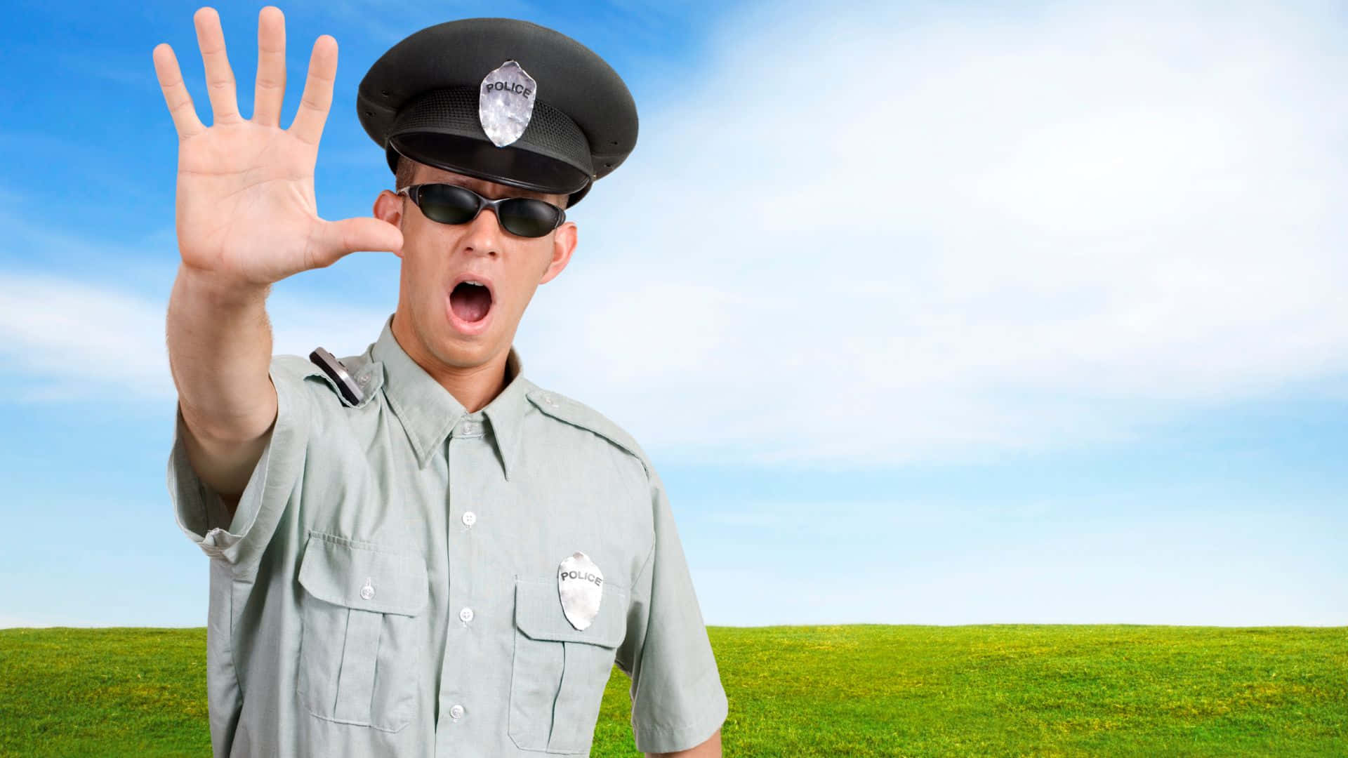 Cop Police Officer With Stop Hand Gesture Wallpaper