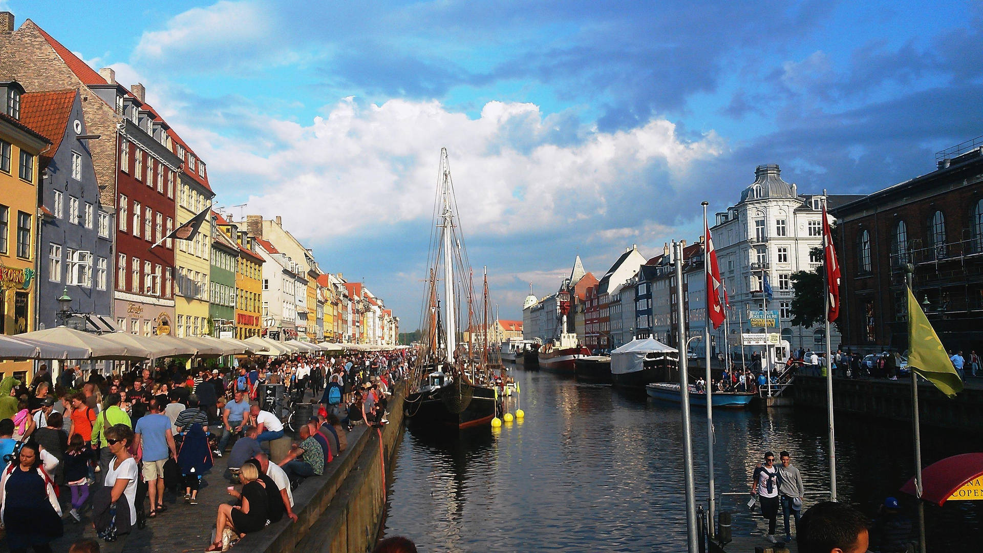 Copenhagen Crowd Near The River Wallpaper