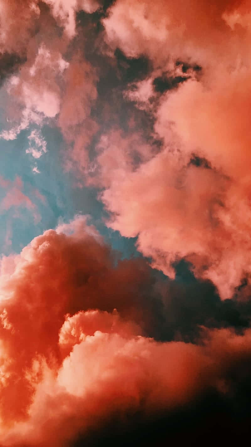 Coral Infused Sky Cloudscape Wallpaper