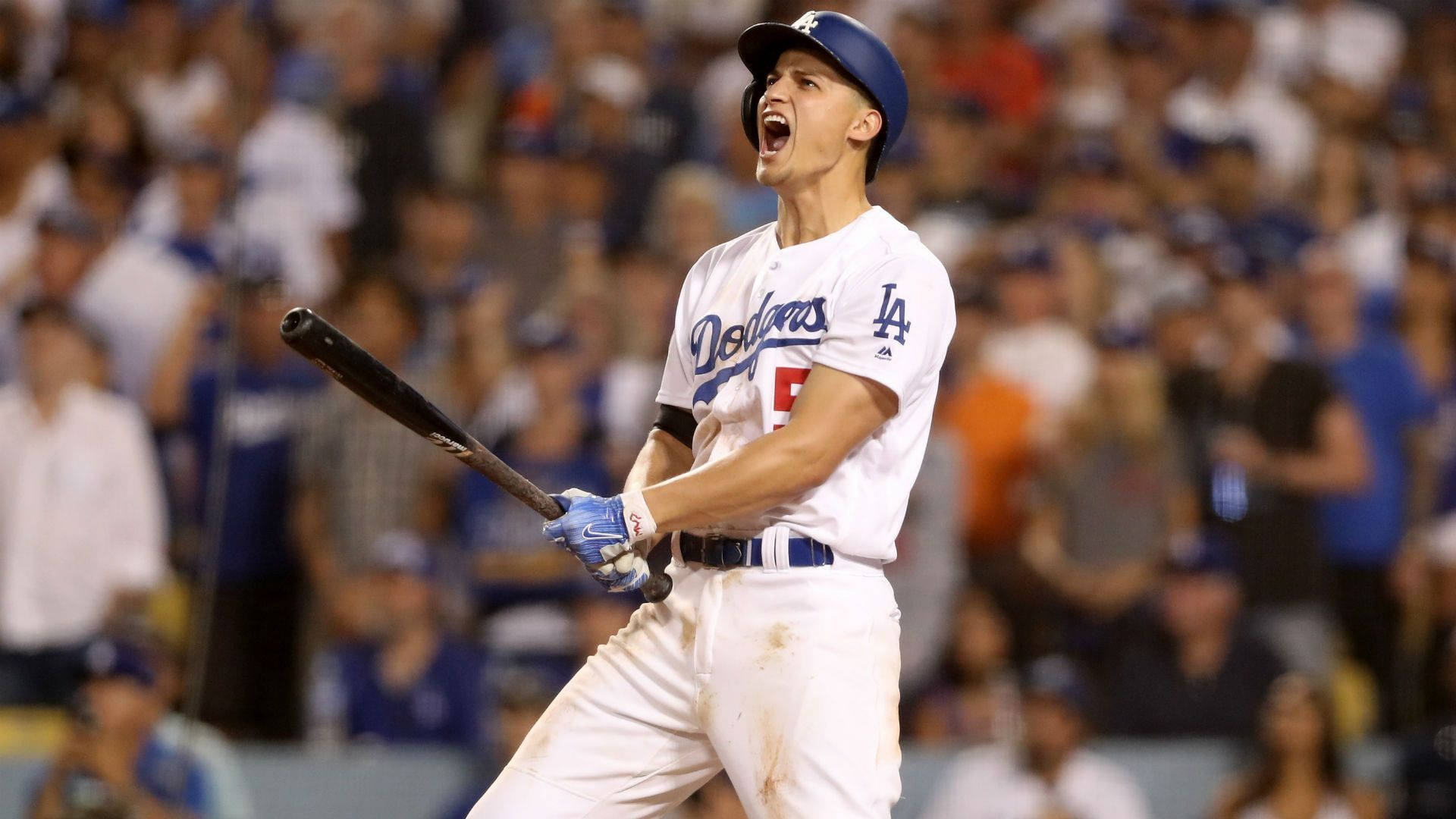 Download Corey Seager Cheering While Holding A Bat Wallpaper