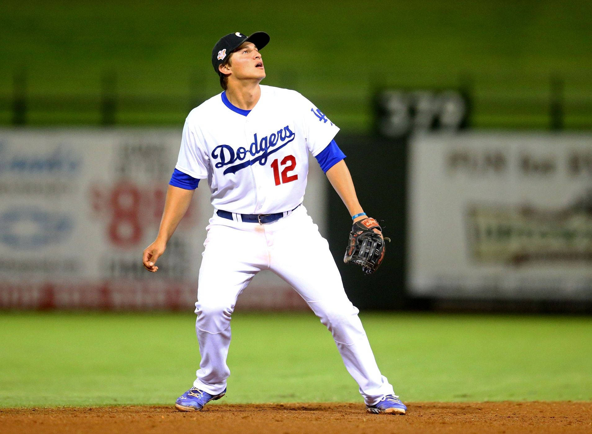 Corey Seager Looking Up And Bracing Himself Wallpaper