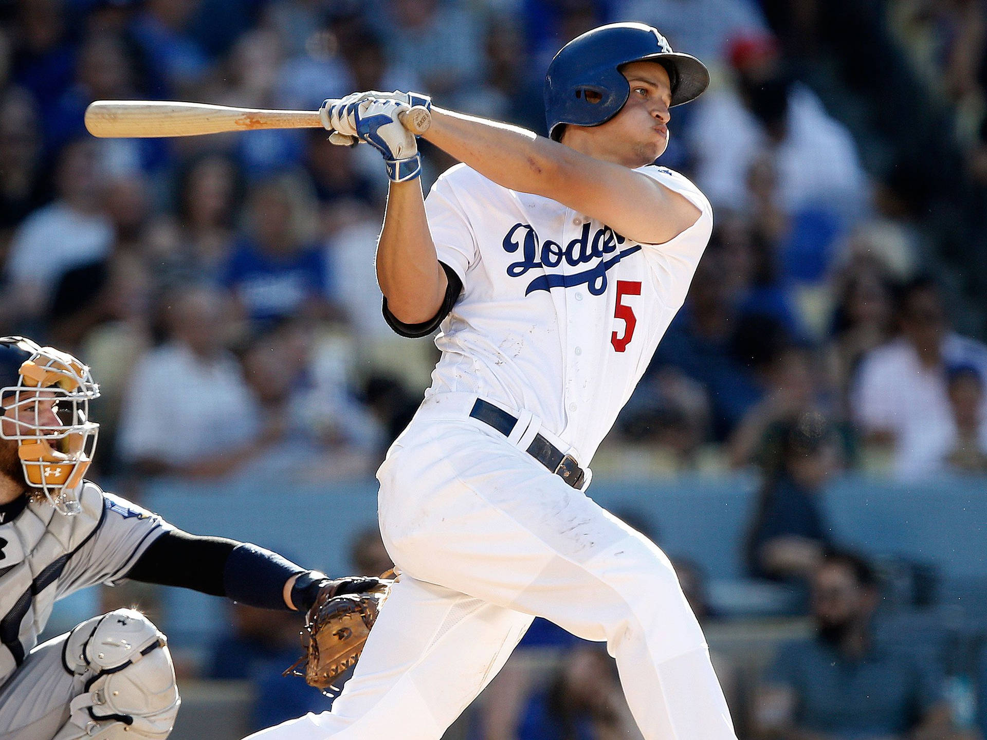 Corey Seager Swinging His Bat With Puffed Cheeks Wallpaper