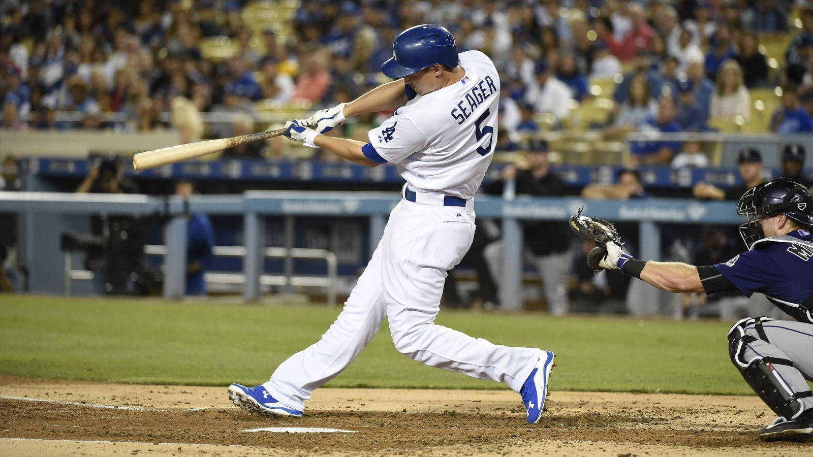Download Corey Seager Swinging While Skipping Wallpaper