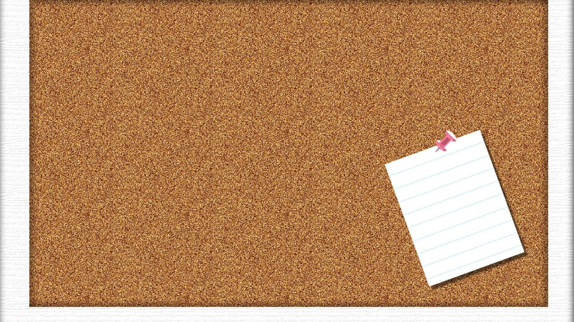 A Cork Board With A Notepad And A Notepad