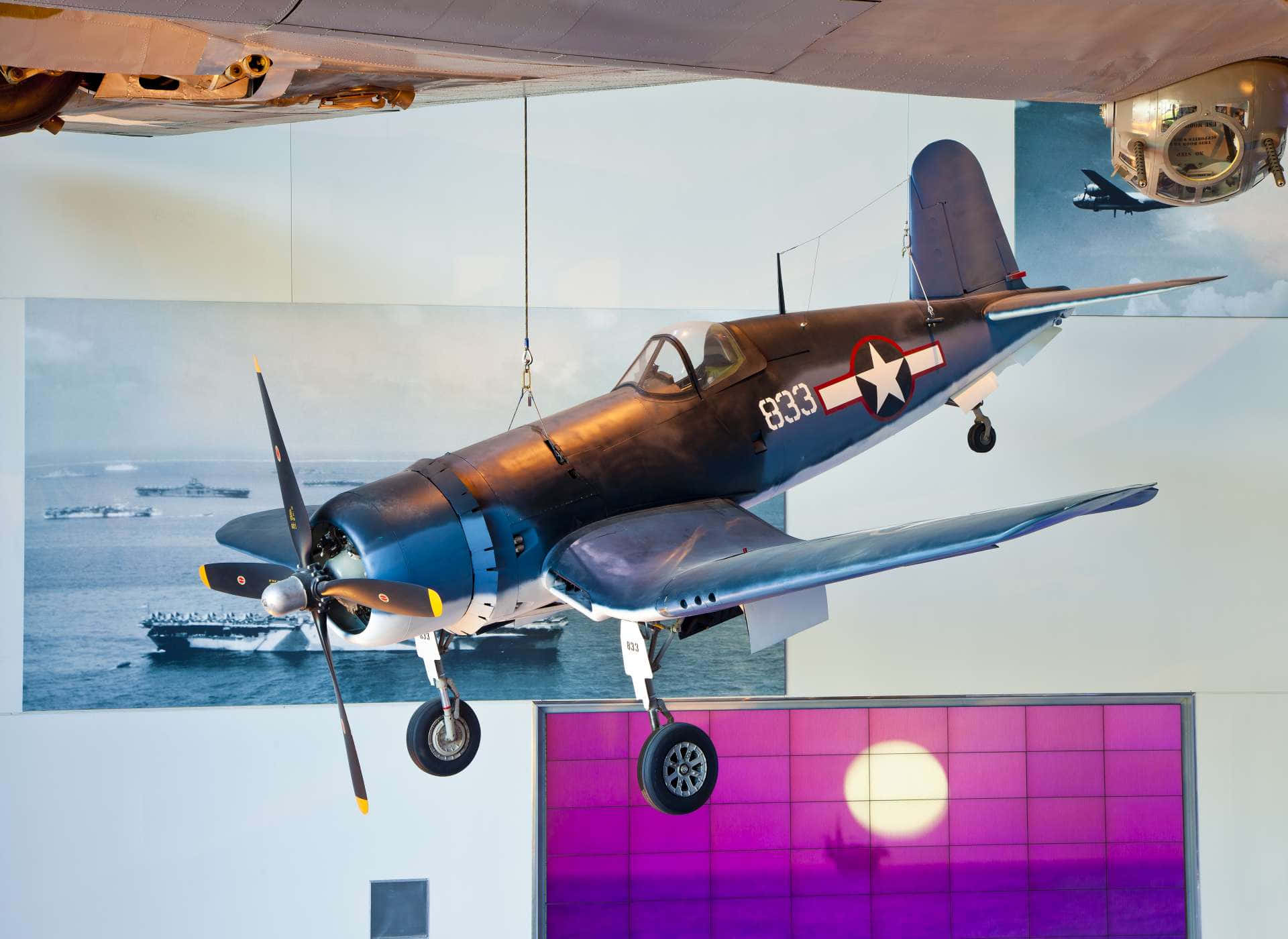 A Plane Hanging From The Ceiling In A Museum