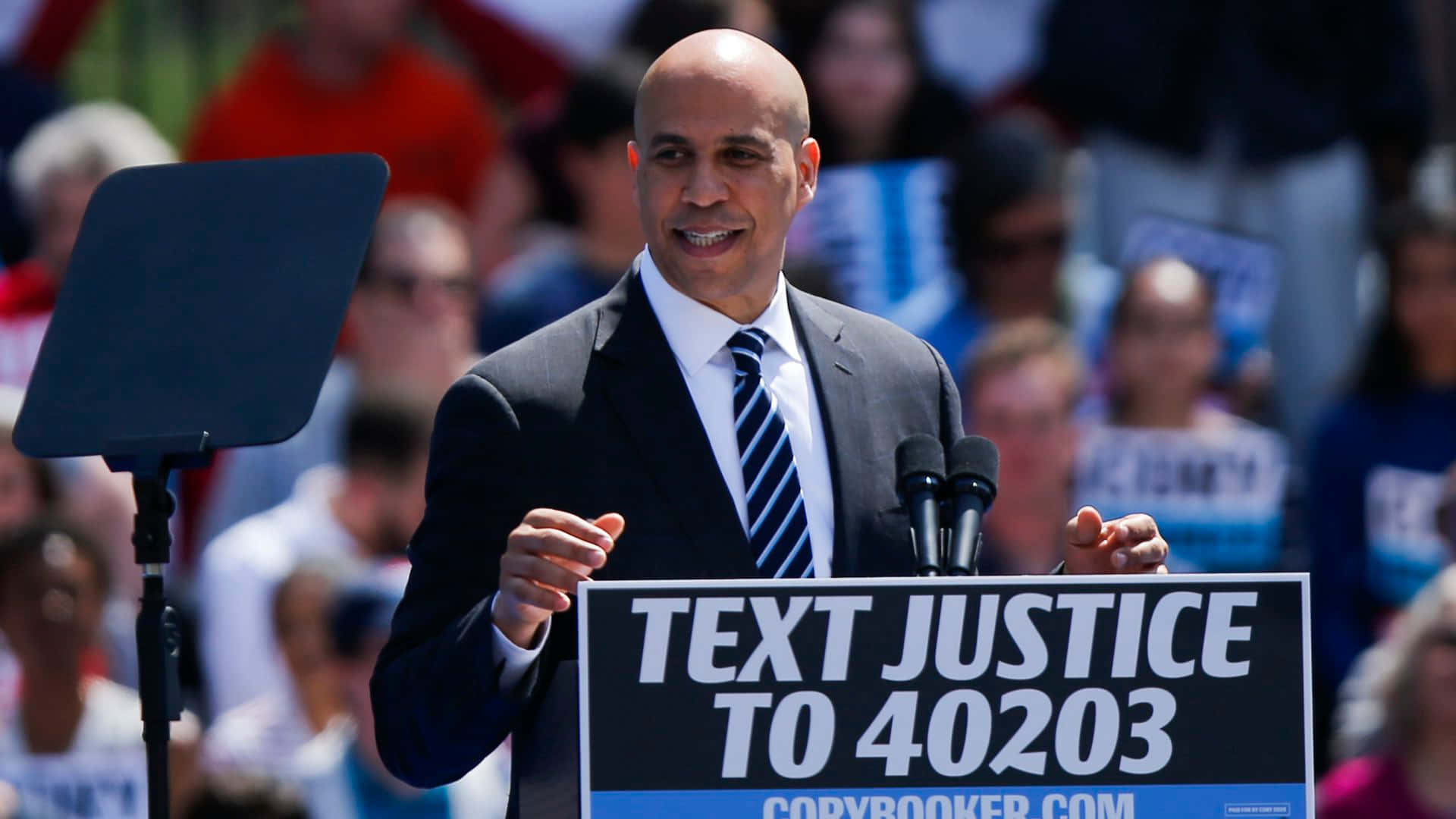 Cory Booker With Sign Wallpaper