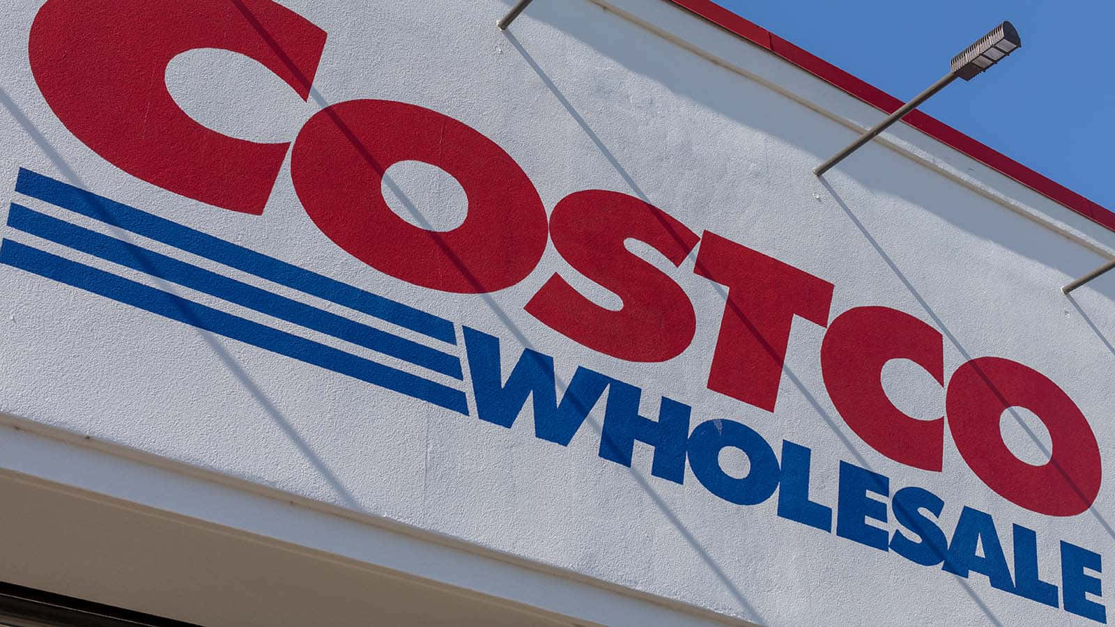 Costco Wholesale Is A Large Store With A Blue And Red Sign