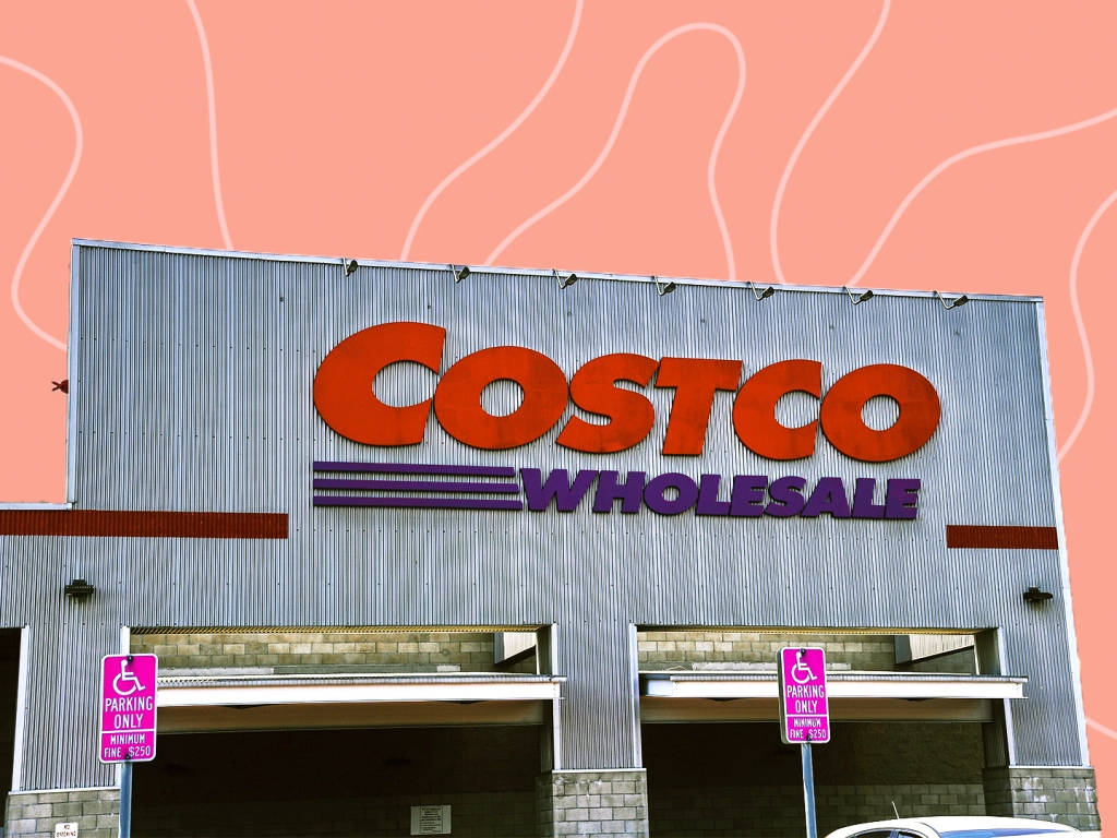 Bustling Costco Store Against Vivid Orange Backdrop Wallpaper