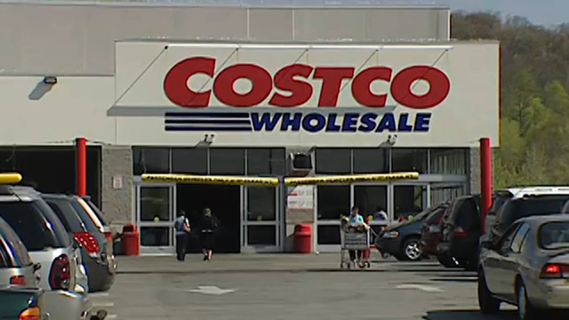 Hustle and Bustle at Costco Wholesale Parking Lot Wallpaper
