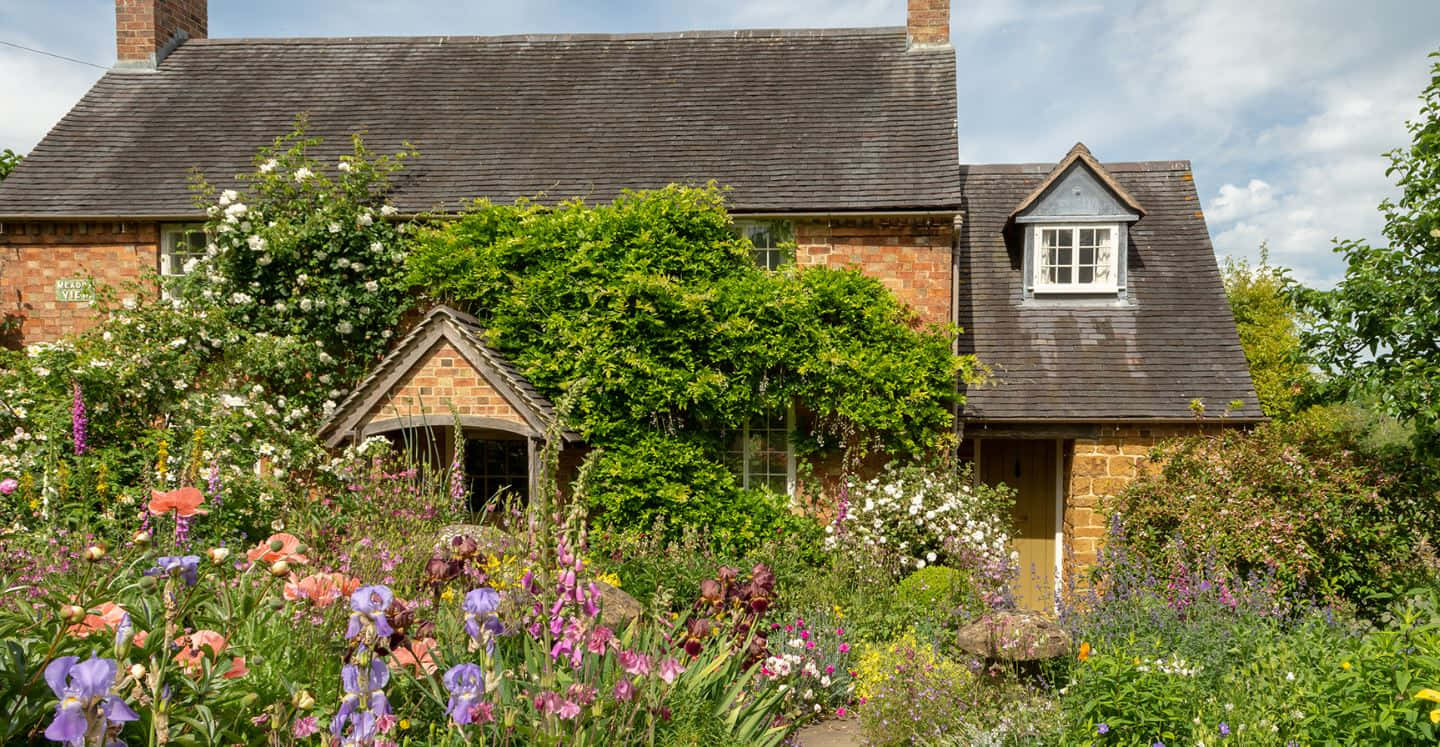 Cottage Garden in Full Bloom Wallpaper