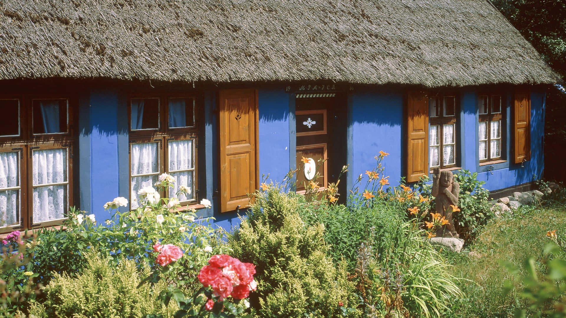Enchanting Cottage Garden in Full Bloom Wallpaper