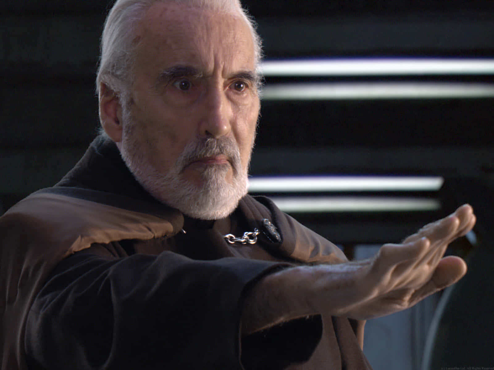 Count Dooku in action - wielding his red lightsaber Wallpaper