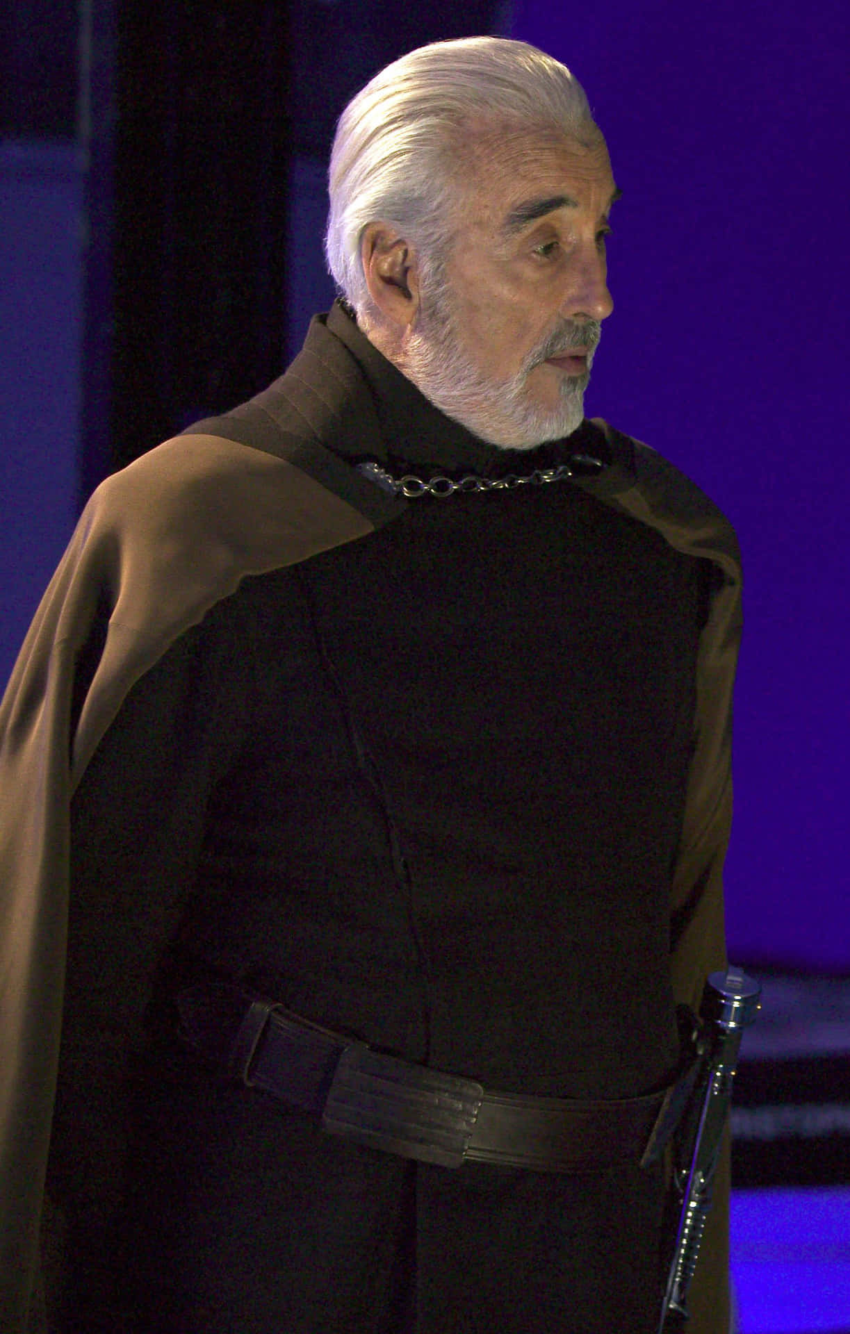 Fearless Count Dooku wielding his iconic red lightsaber Wallpaper