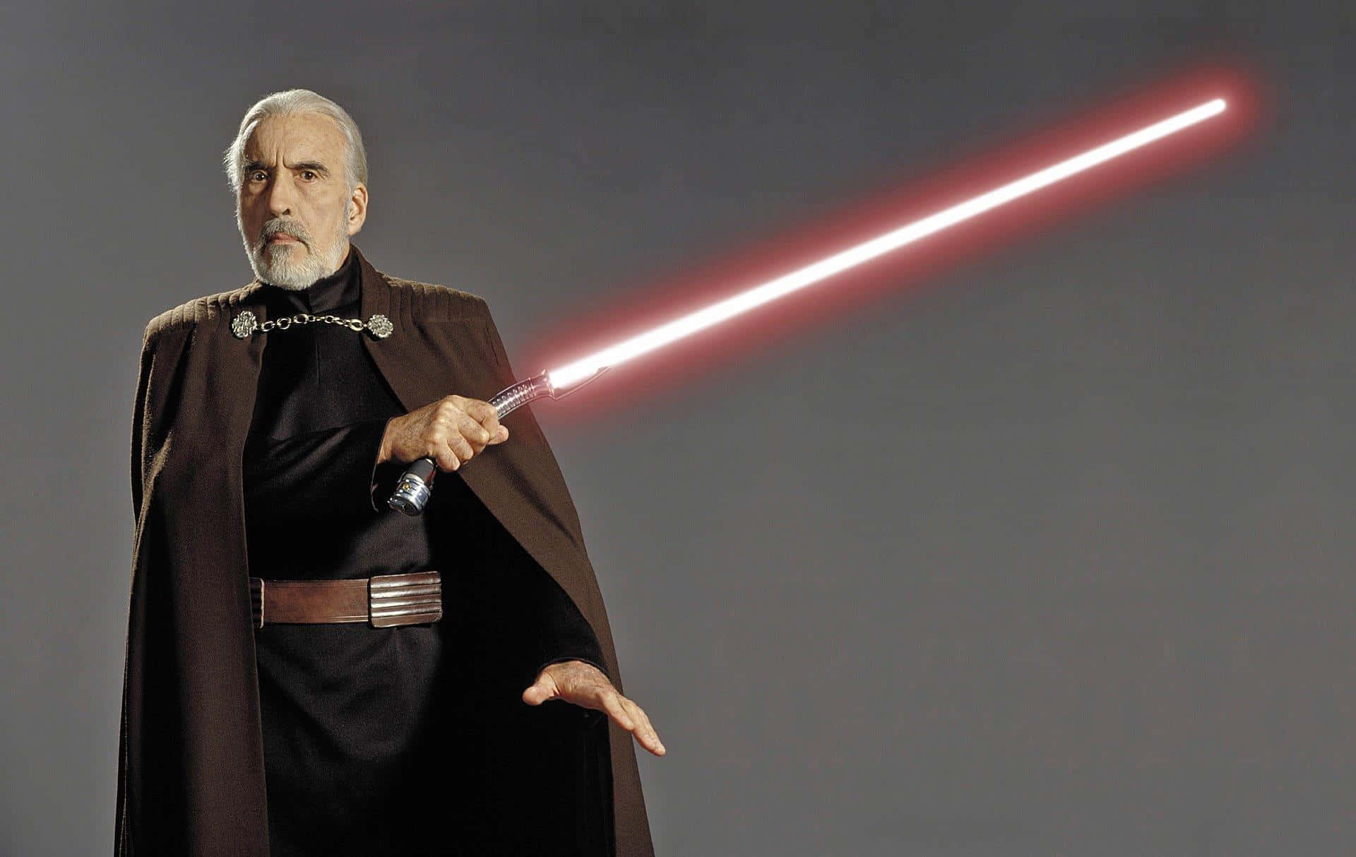 Masterful Count Dooku wielding his iconic lightsaber Wallpaper