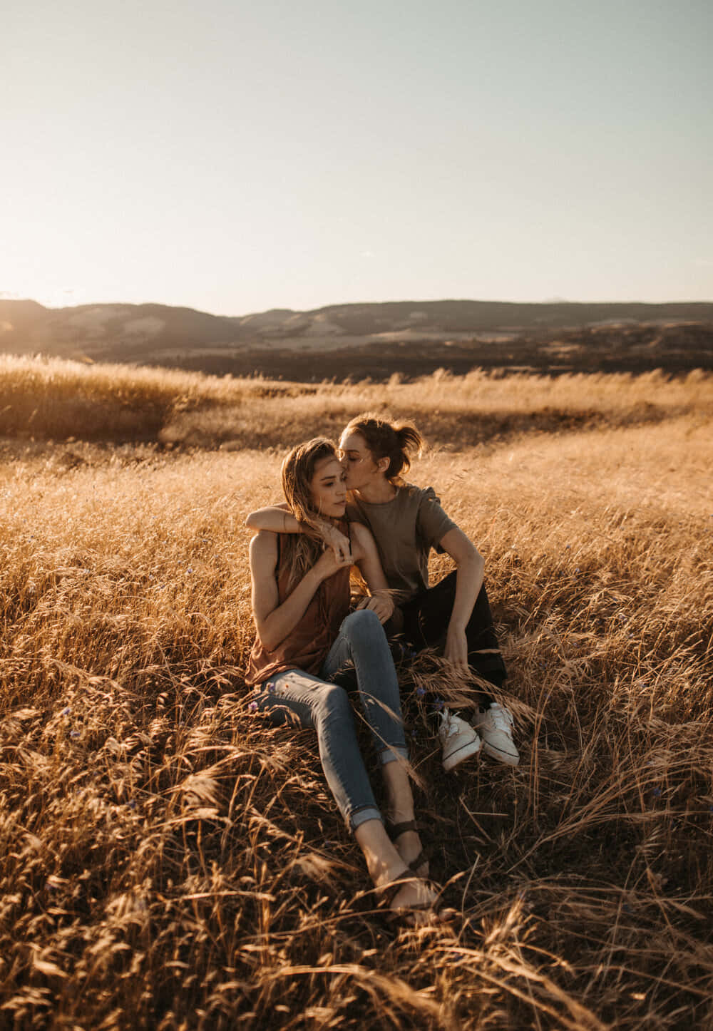 Country Couple Sitting In The Field Picture