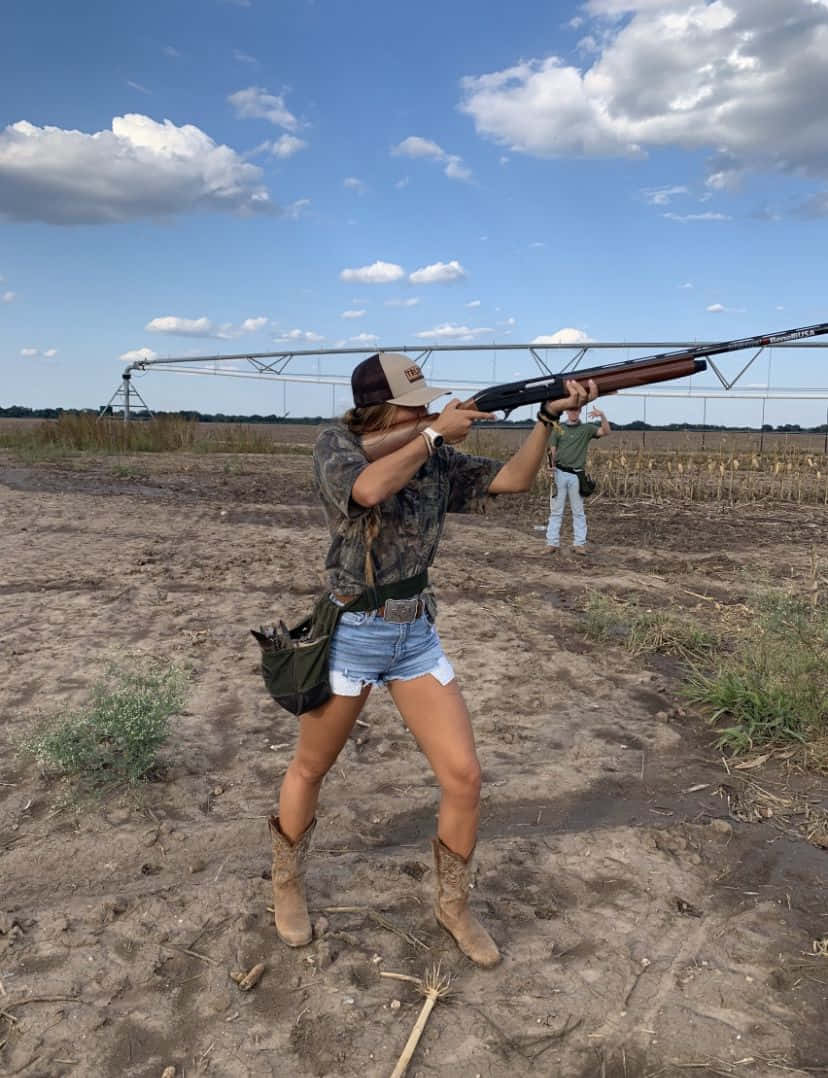 Country Girl Clay Shooting Outdoors Wallpaper