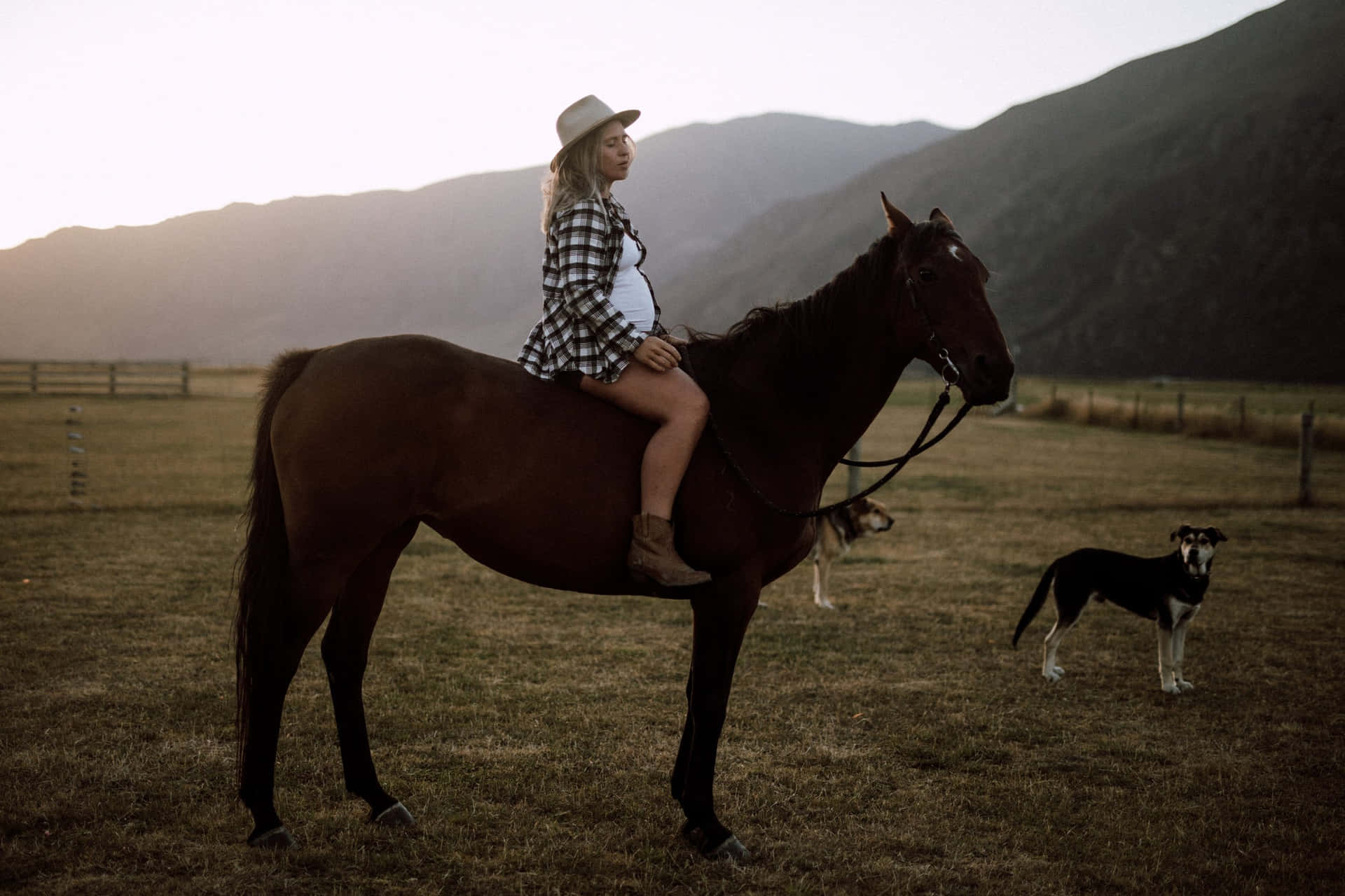 Country Girl Horseback Ridingat Dusk Wallpaper