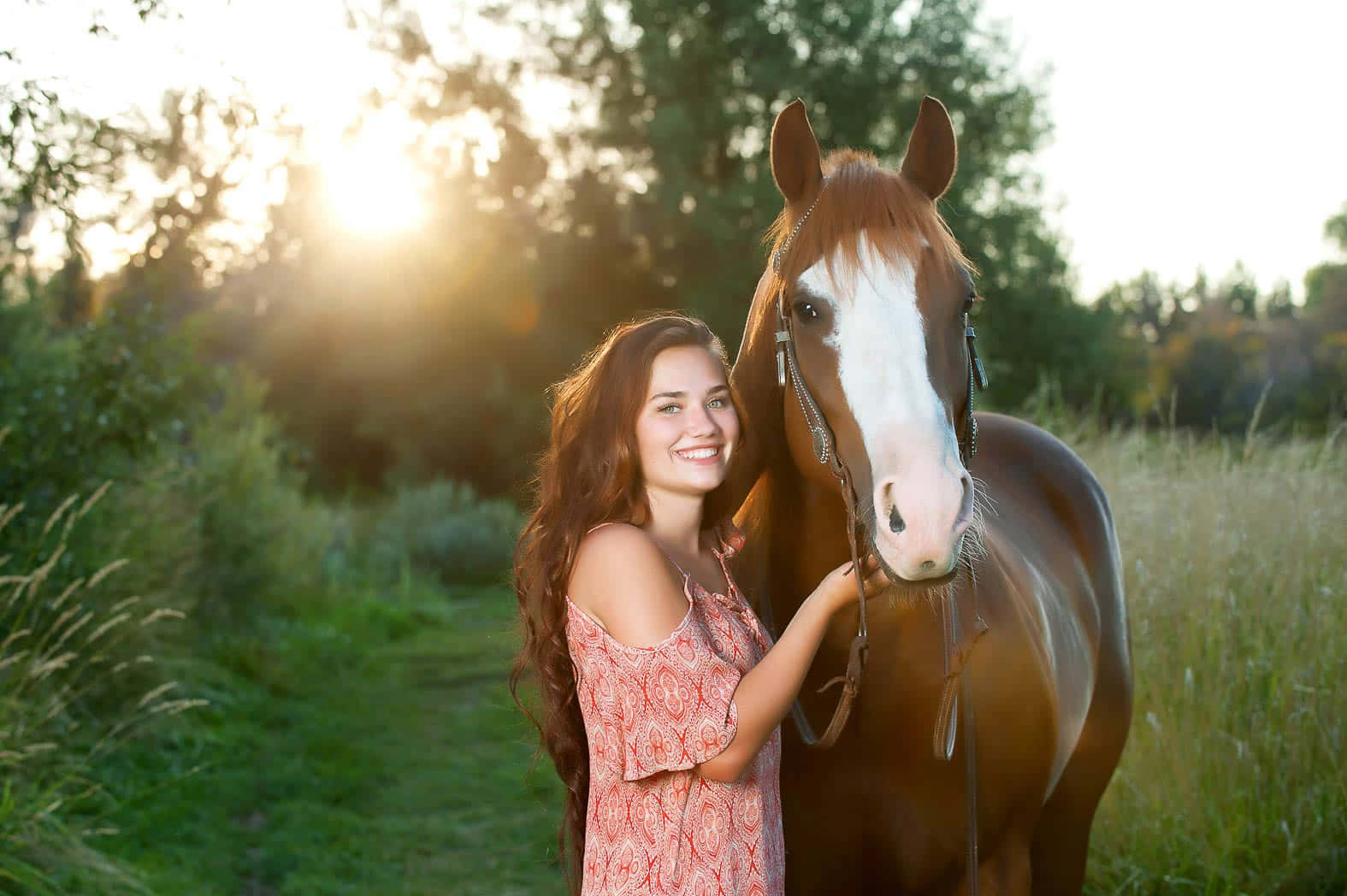 A Girl Poses With A Horse In A Field Wallpaper