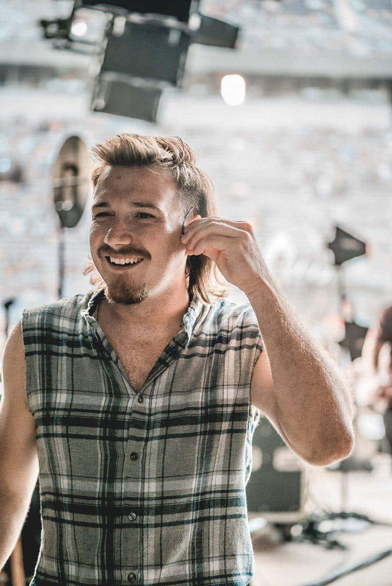 Country Music Artist Smiling Backstage.jpg Wallpaper