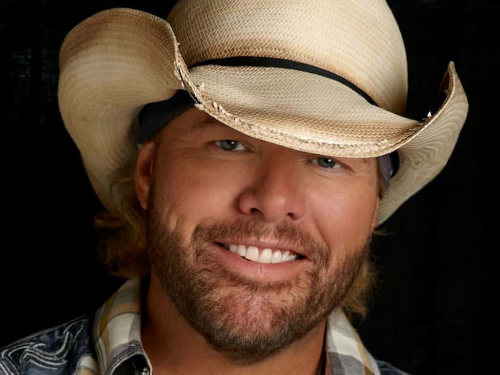 Country Music Artistin Cowboy Hat Wallpaper