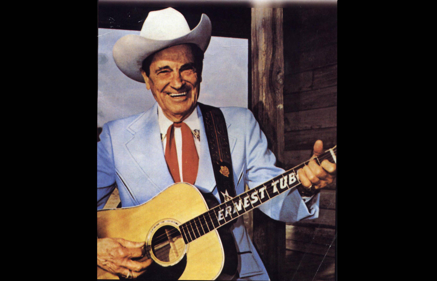 Country Music Icon Ernest Tubb in Performance Wallpaper