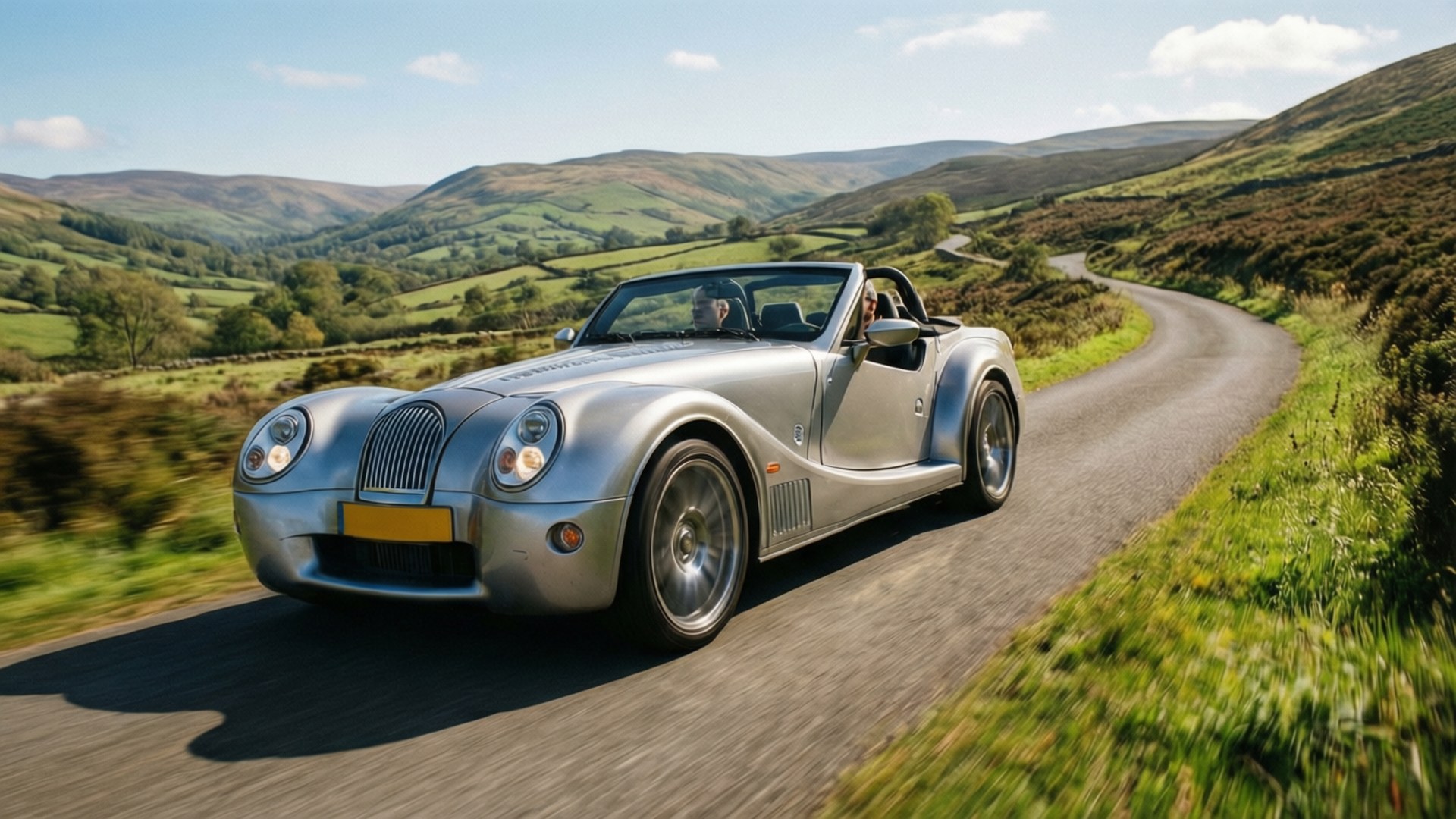Morgan Roadster speeding through countryside with motion blur