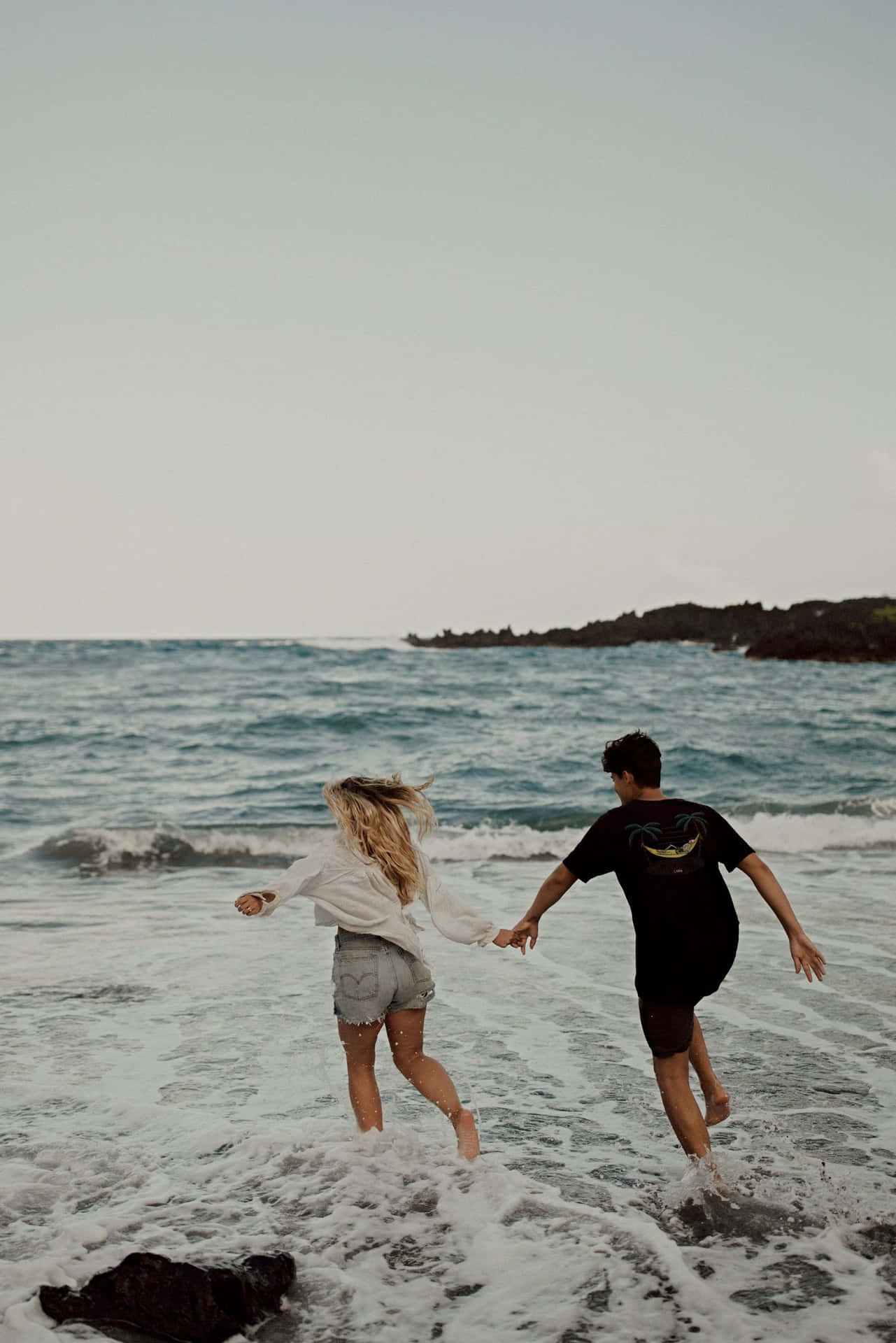 Couple At Beach Running On Water Picture