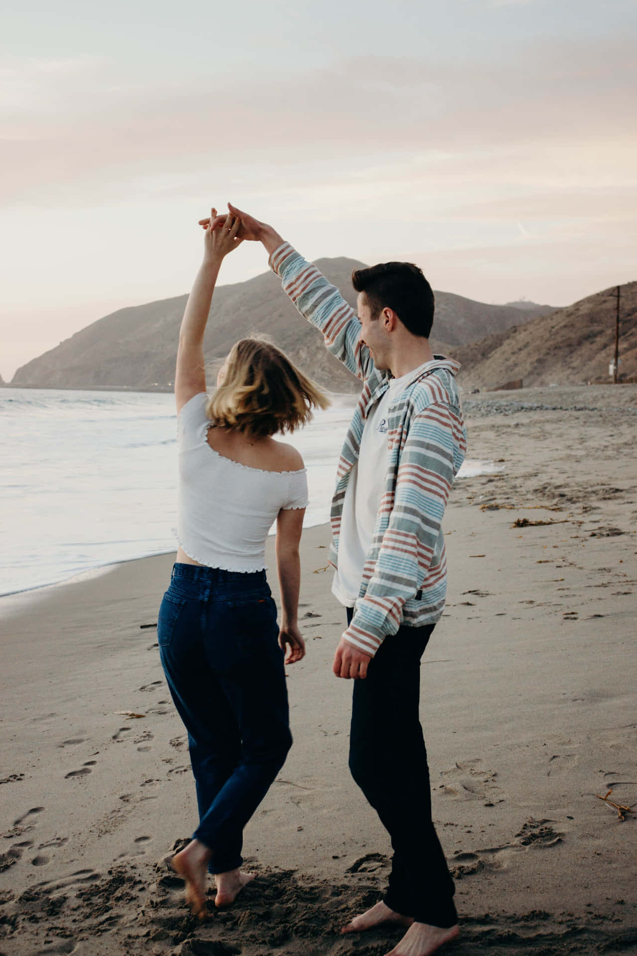 Couple At Beach Dancing With Spin Picture